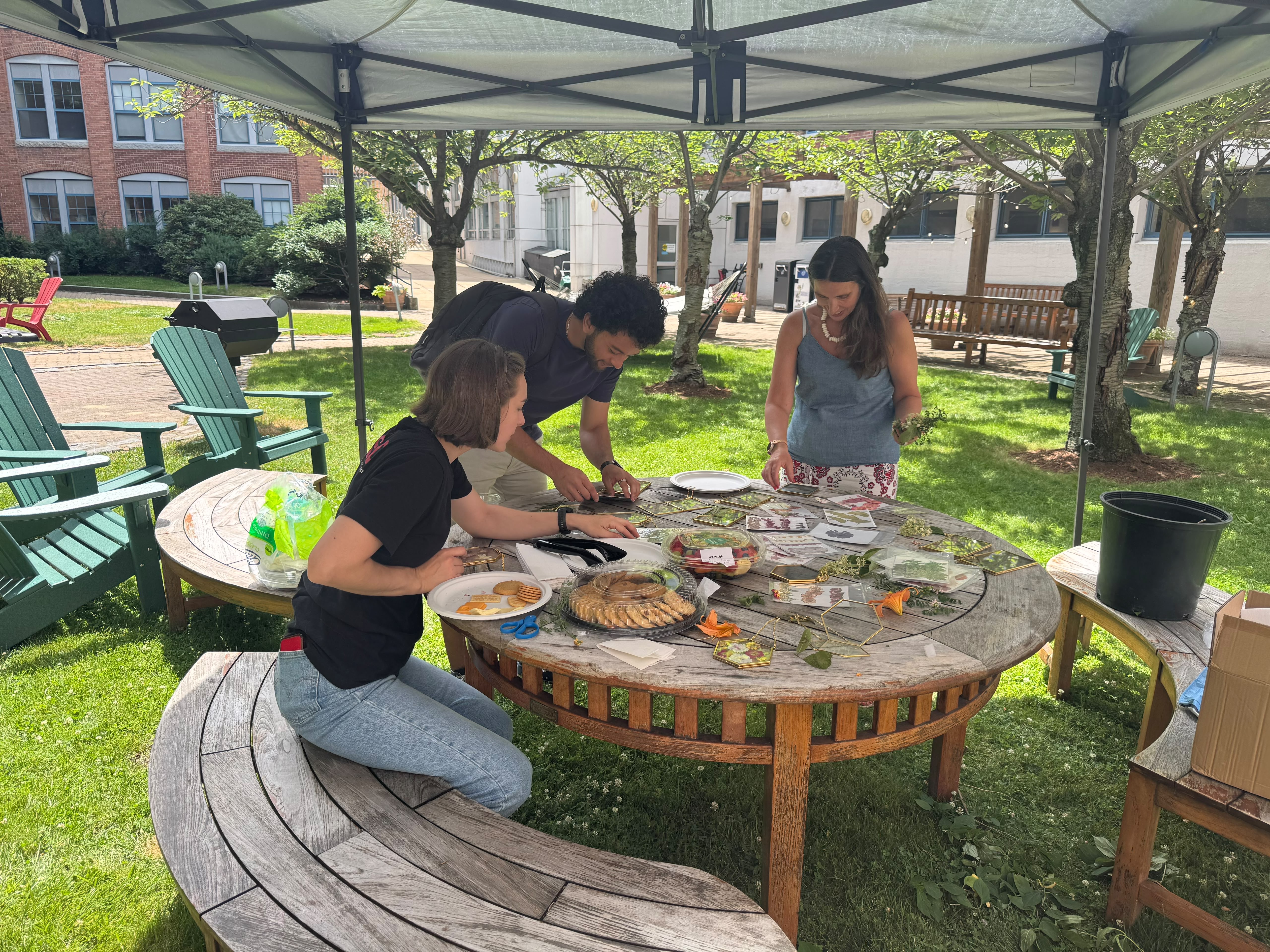 Residents making pressed-flower art in the Edgerton courtyard