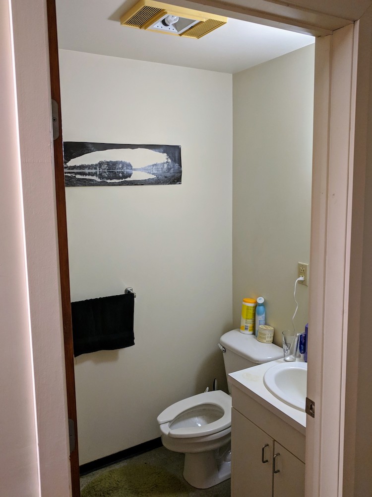 Half bathroom with sink and mirror